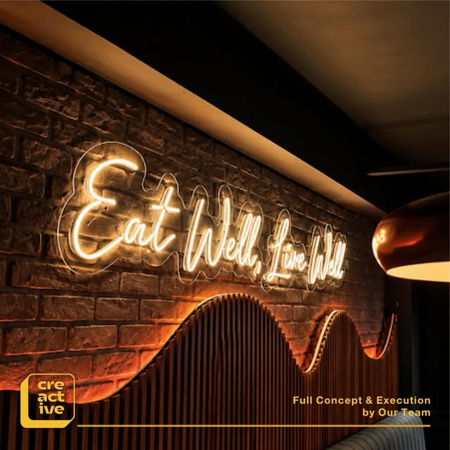 Neon lettering "Eat Well, Live Well"