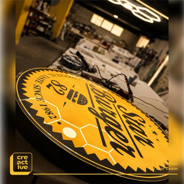 Round illuminated sign in production