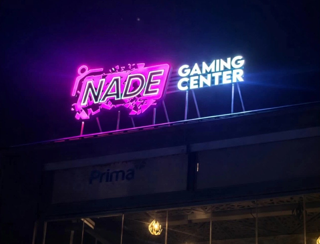 Rooftop sign of the Nade Gaming Center at night