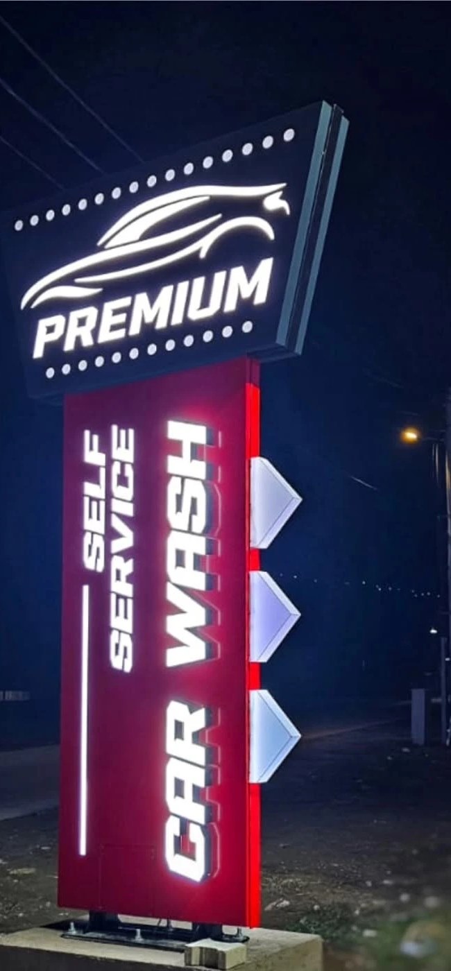 Illuminated totem for Premium Self Service Car Wash at night