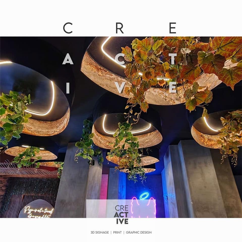 Rossini – Illuminated ceiling shapes with greenery and neon